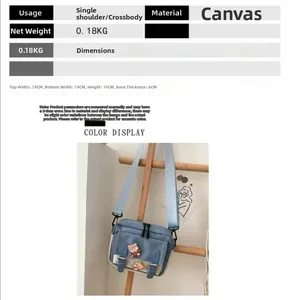 Size chart and details of a small blue canvas crossbody bag with bear pins