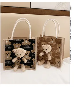Detail of cute bear jute tote bags showing woven texture and 3D plush teddy bear ornaments