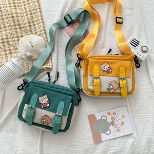 Cute canvas crossbody bag with cartoon bear embroidery and adjustable shoulder strap