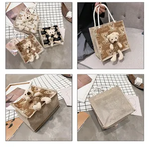 Detail of canvas mini tote bag with plush 3D bear ornament and bear pattern print