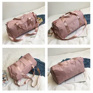 Pink nylon fitness bag detail showing large main compartment and separate shoe pocket