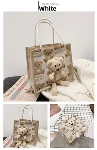Detail of cute bear embroidery and 3D plush bear on white canvas tote handbag