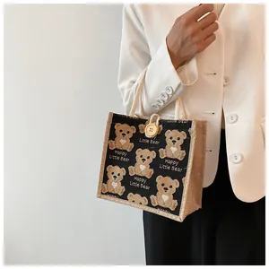 Detail of linen tote bag with cute cartoon bear print and premium cotton rope handle