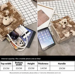 Size guide for cute bear canvas tote bag showing internal capacity for iPad and phone