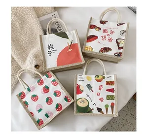 Detail of canvas tote bags with cotton rope handles and Japanese fruit patterns