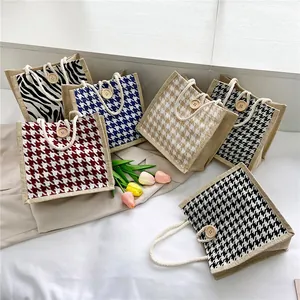 Mini woven jute handbag with stripes and houndstooth pattern and wooden button