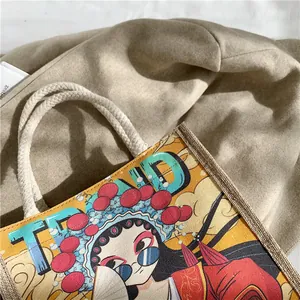Detail of canvas tote bag featuring Beijing Opera print and woven rope handles