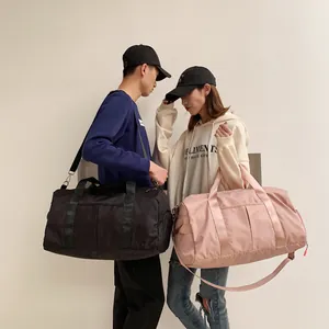 Detailed view of spacious nylon fitness bags with side pockets and sturdy shoulder straps