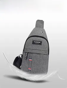 Detailed view of gray oxford fabric crossbody bag featuring lightweight 0.18KG design