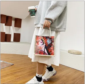 Detailed view of canvas tote bag featuring traditional Chinese ink graffiti illustrations