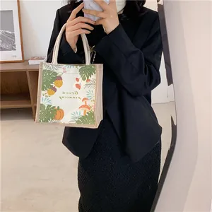 Close-up of canvas tote bag featuring Green Morning pattern and white rope handle