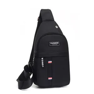 Detail of black oxford fabric sling bag featuring tri-color stripes and fashion logo