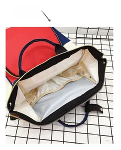 Internal view showing elastic compartments and large capacity of the colorblock diaper bag