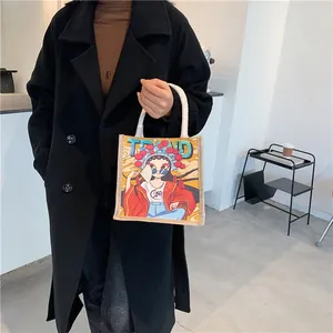 Detail of canvas tote bag with Peking Opera illustration and white rope handles