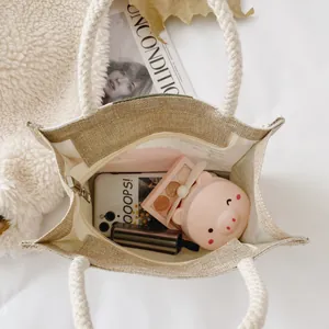 Beige woven canvas tote bag with thick rope handles and spacious interior for essentials