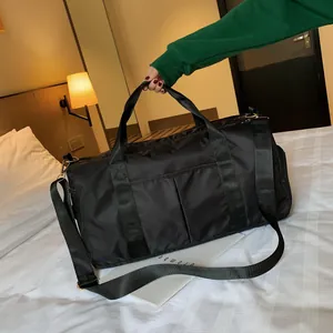 Detail of waterproof nylon fitness bag with reinforced handles and adjustable strap