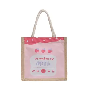 Pink canvas strawberry milk handbag with woven rope handles and cute strawberry print