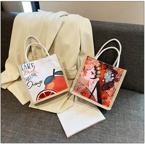 Detail of canvas tote bags with artistic orange and traditional Chinese opera prints