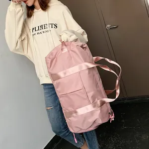 Pink waterproof nylon fitness bag with wet-dry separation and reinforced straps