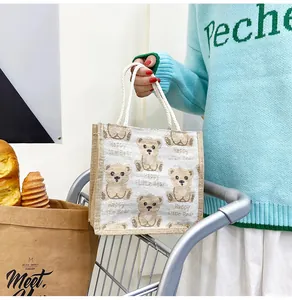 Detail of the linen tote bag with cartoon bear pattern and soft cotton rope handles