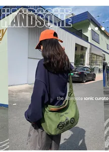 Chic military green canvas crossbody bag featuring vintage motorcycle graphics and wide strap