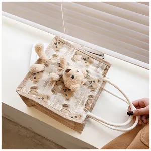 Detail of canvas lunch bag featuring cute 3D plush bear and bear pattern prints
