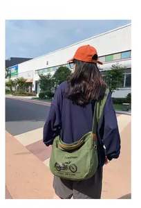 Army green canvas messenger bag featuring vintage motorcycle print and wide shoulder strap