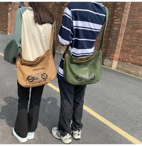 Canvas messenger bags with vintage motorcycle prints and wide shoulder straps