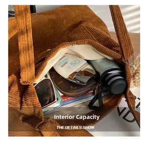 Internal capacity of brown corduroy tote bag showing spacious room for daily essentials