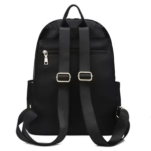 Back view of black casual backpack featuring adjustable straps and a hidden anti-theft pocket