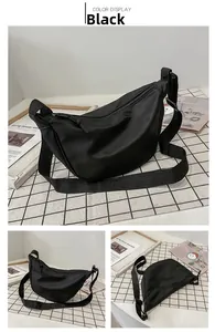 Vista detallada del bolso de nailon negro en forma de medialuna desde varios ángulos