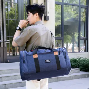 Large capacity waterproof blue nylon travel bag with shoulder strap and GIM brand logo