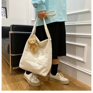 Cream white corduroy tote bag with Fashion text and cute brown bear pendant