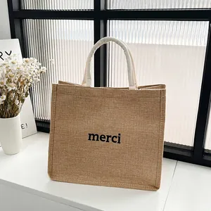 Sac fourre-tout en jute avec imprimé merci noir et poignées en corde blanche pour voyage