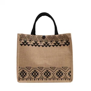 Minimalist jute tote bag with black tribal patterns and round button closure for women
