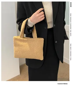 Detail of soft khaki plush tote bag with lamb wool texture and twin top handles