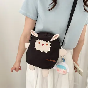 Sac bandoulière mouton en peluche noire avec broderie mignonne et pendentif poupée