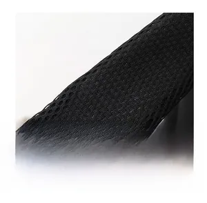 Close-up of black breathable mesh shoulder strap with honeycomb structure for mens chest bag
