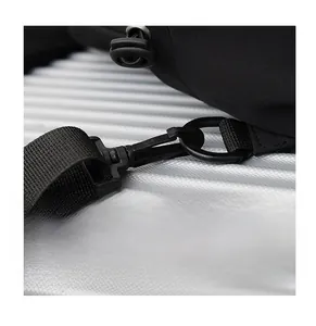 Detail of durable black plastic swivel hook and woven shoulder strap on chest bag