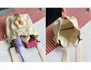 Internal capacity of canvas bucket bag holding a phone, umbrella, and cosmetics