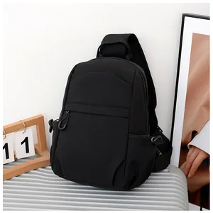 Detail of breathable honeycomb mesh shoulder strap on black minimalist chest bag