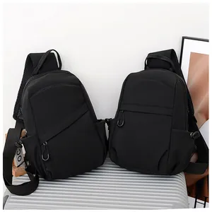 Detail of two black waterproof nylon chest bags featuring breathable mesh shoulder straps