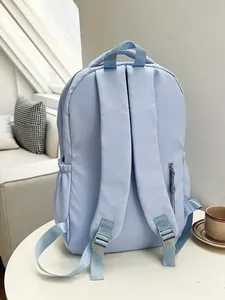 Minimalist light blue laptop backpack with wide shoulder straps and anti-theft zipper pocket