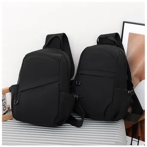 Detail of black waterproof nylon crossbody bag with breathable mesh back and side pocket