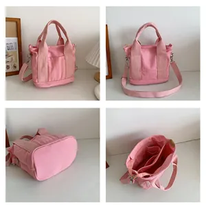 Dettagli della borsa tote in tela rosa che mostrano l'interno a scomparti e le tracolle