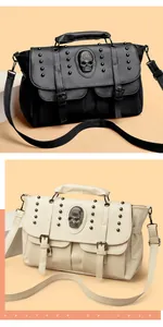 Close-up of punk style rivet bag with skull ornament and lychee grain faux leather texture