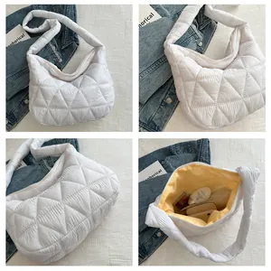 Detailed views of white quilted puffer bag with yellow lining and spacious interior