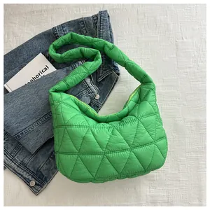 Detailed top view of grass green quilted puffer bag with chic diamond stitching pattern