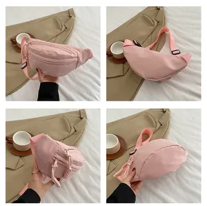 Pink nylon fanny pack details showing dual zippers and adjustable straps from various angles