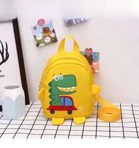 Detail of yellow canvas dinosaur kids bag with Follow Me Dude print and side fins